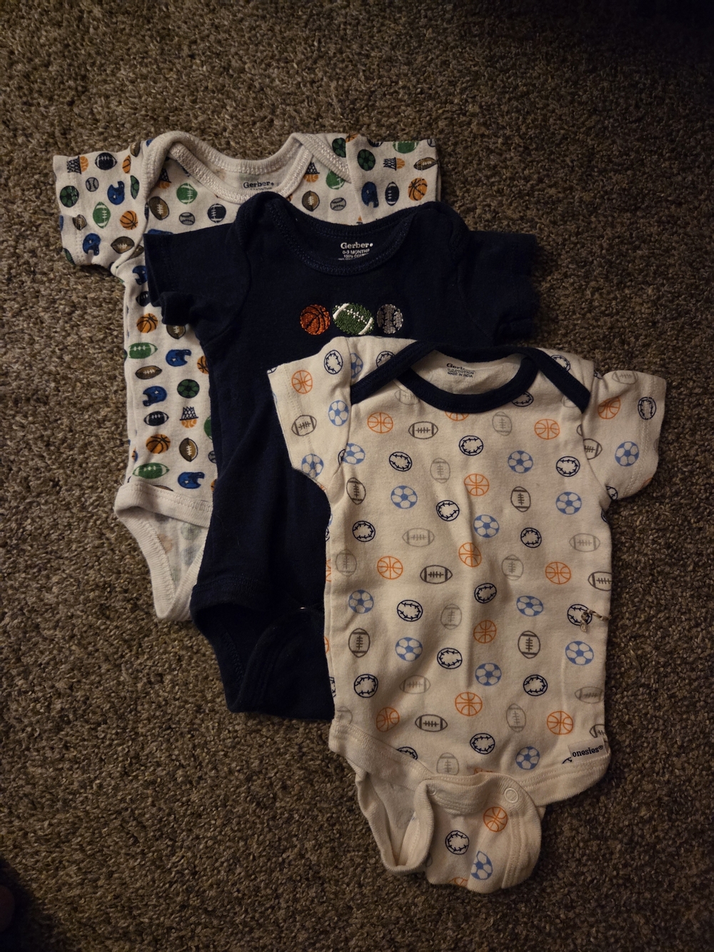 Gerber Baby Onesie 3-Pack in Navy, White, and Multicolor Sports Print